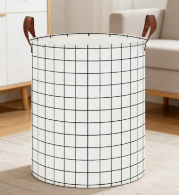 Round, foldable laundry basket for organizing clothes, white checkered pattern.